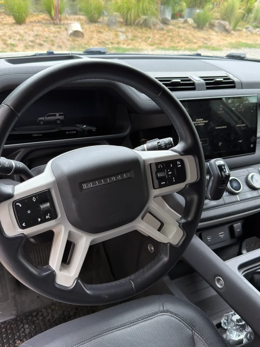 Before: steering wheel and dashboard with dust and smudges