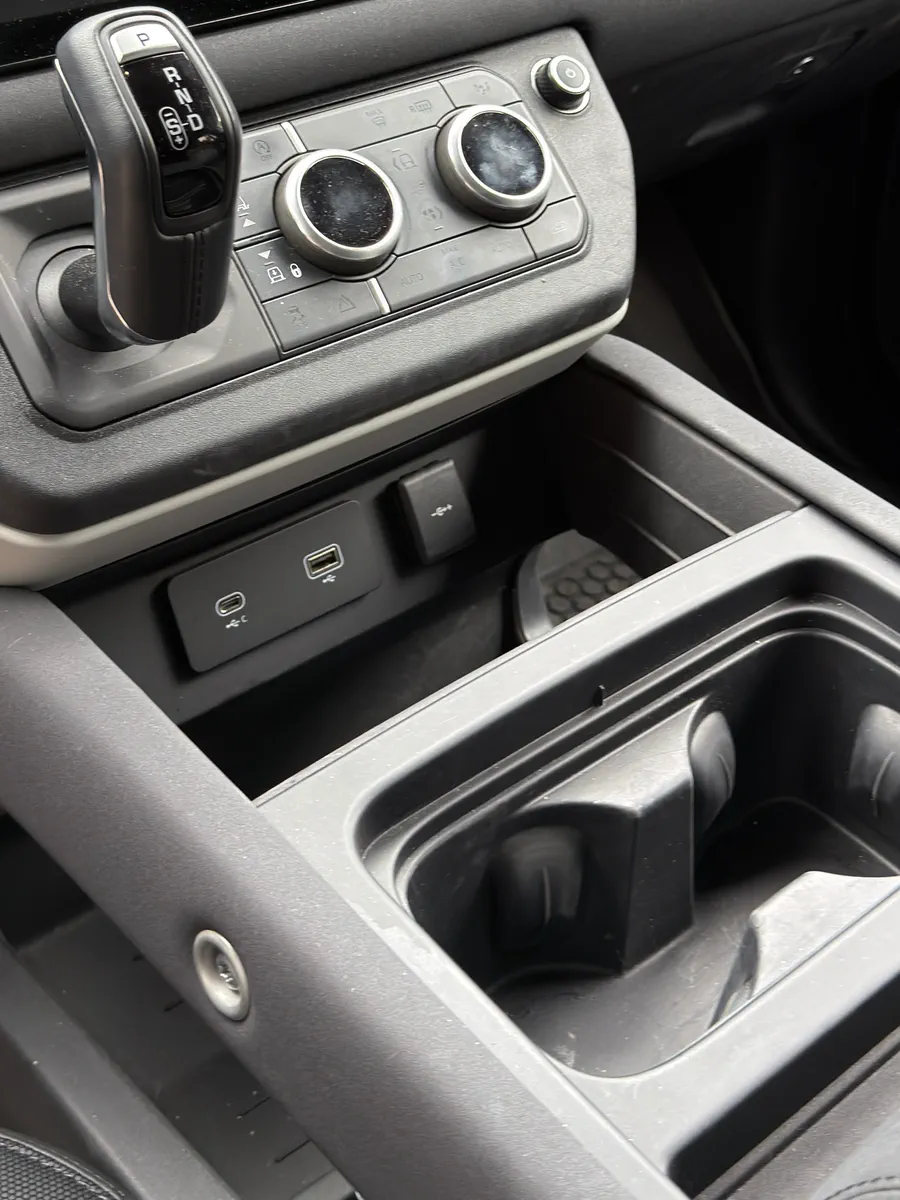Before: center console and cupholders with dust in the seams